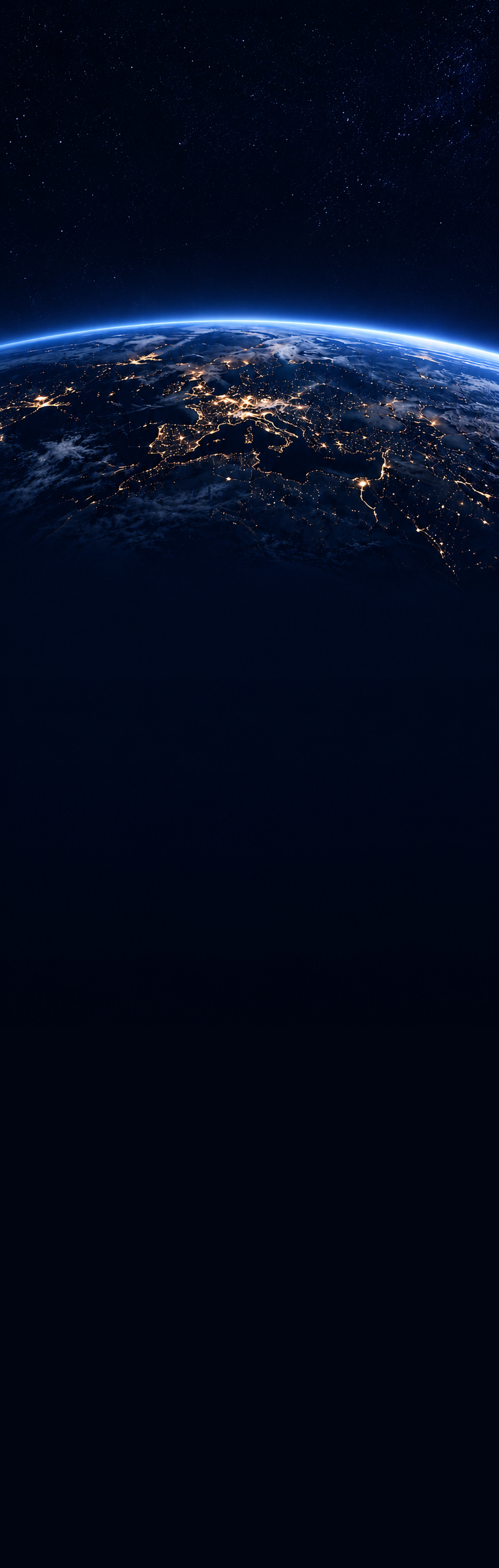 The earth at night seen from orbit, a bright blue atmospheric horizon above a band of city lights, with deep space extending below